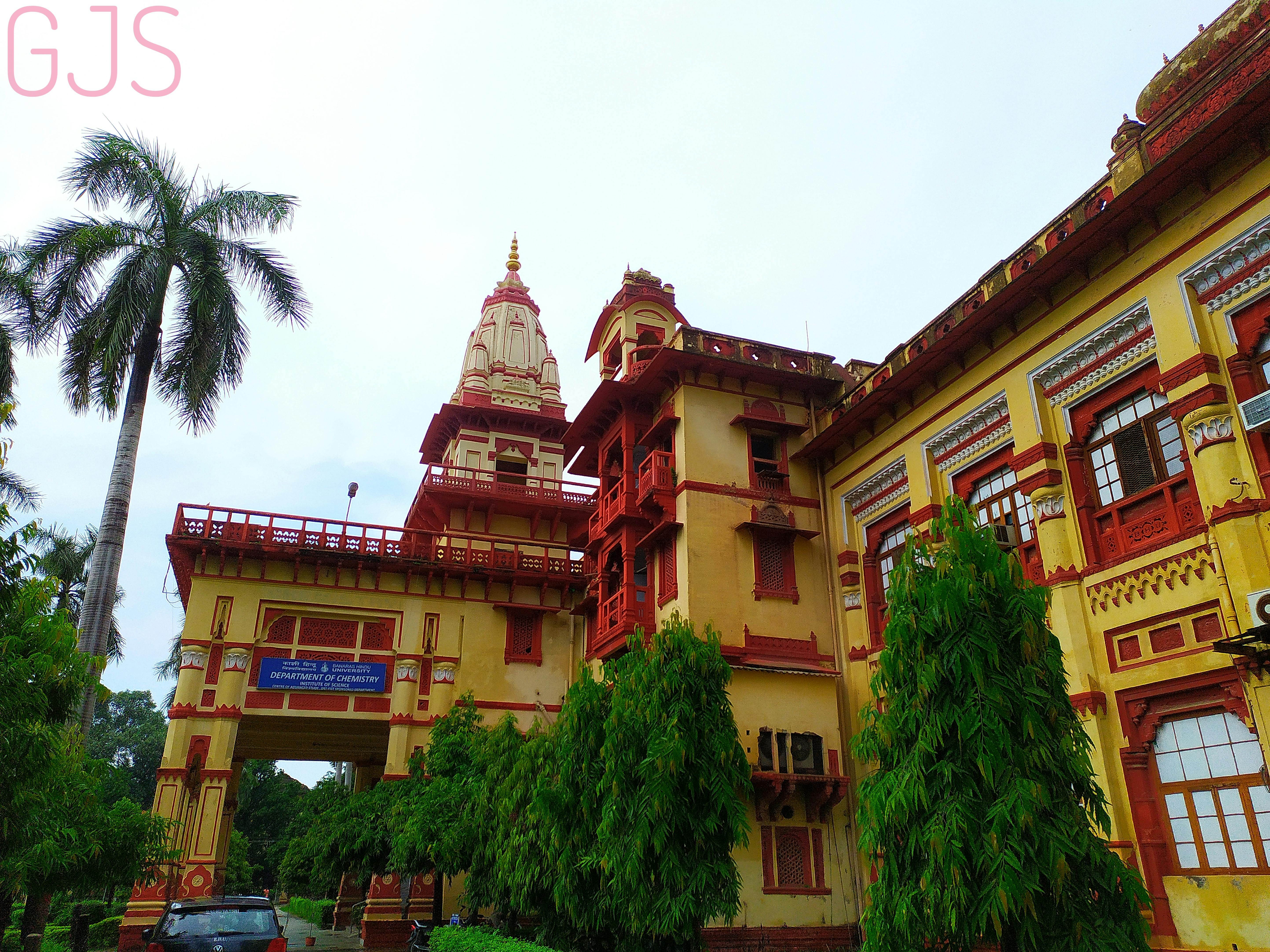 Glass jar of chia pudding with fruit and seeds on a wooden table