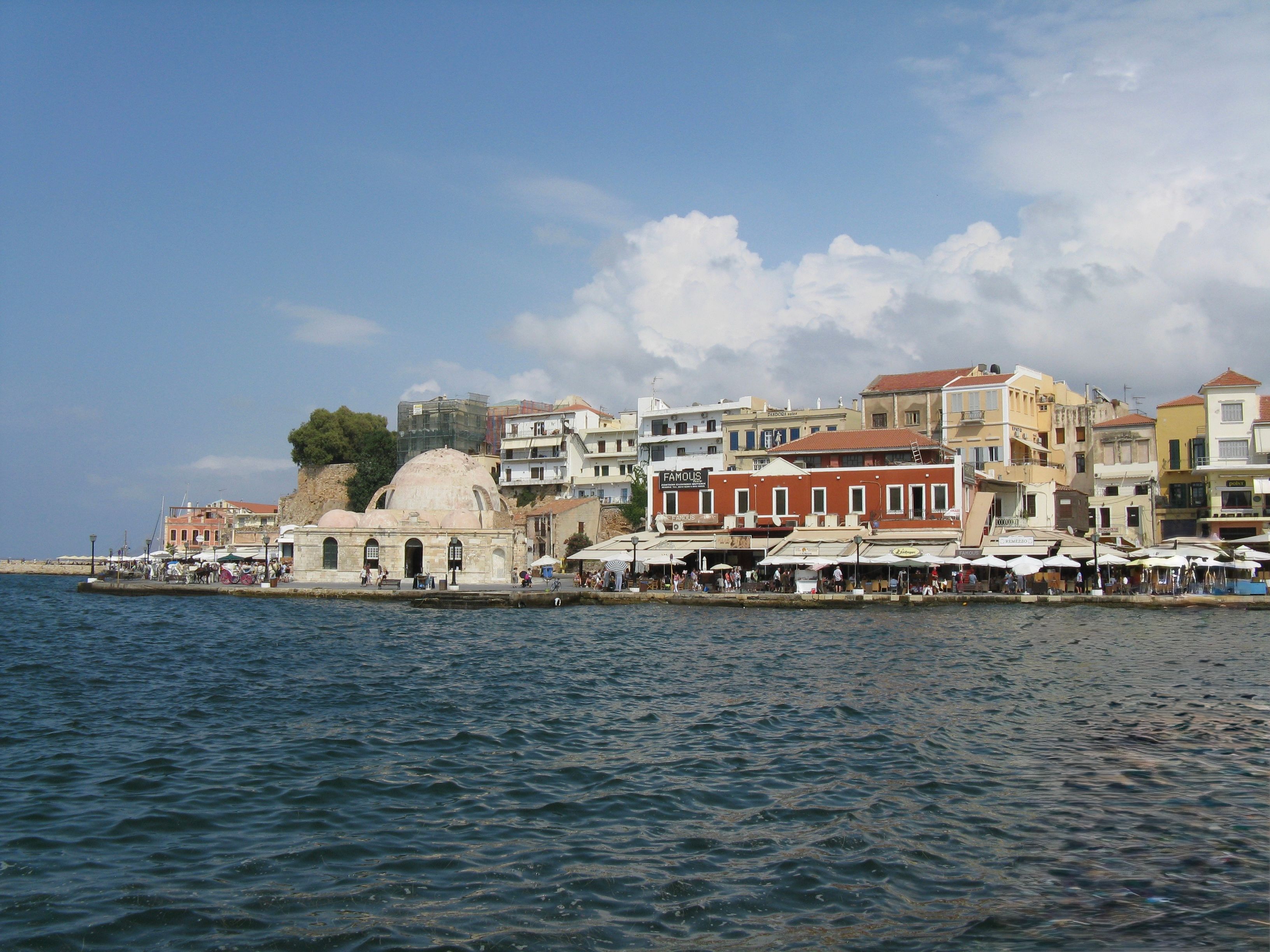 The Venetian harbour waterfront at Chania, Crete, in warm evening light