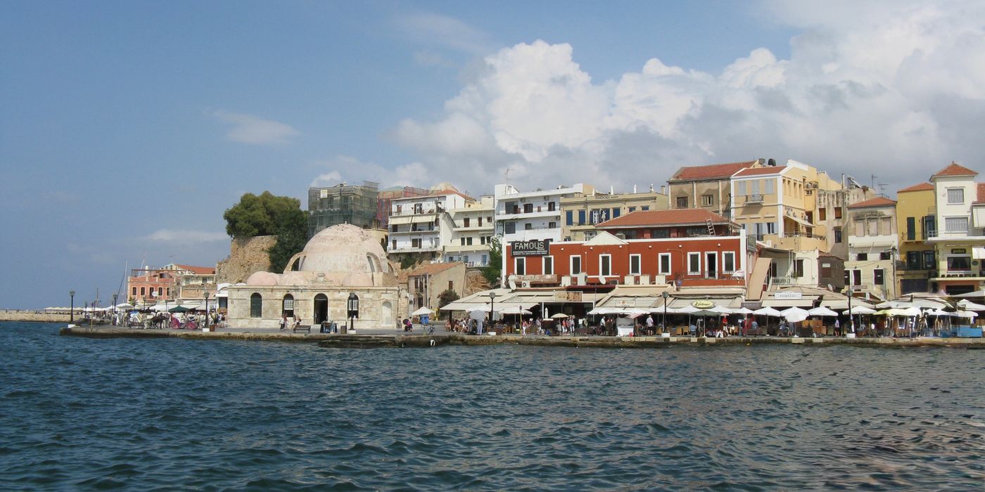 The Venetian harbour waterfront at Chania, Crete, in warm evening light
