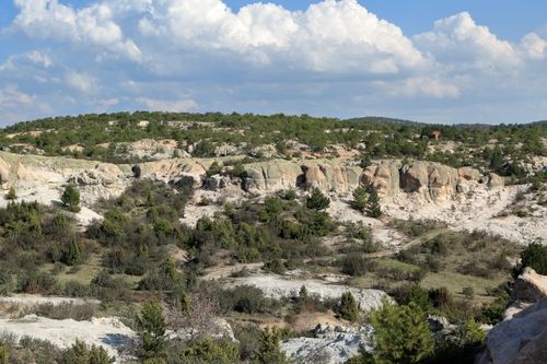 Free Stunning natural rocky landscape under a bright blue sky with scattered clouds. Stock Photo