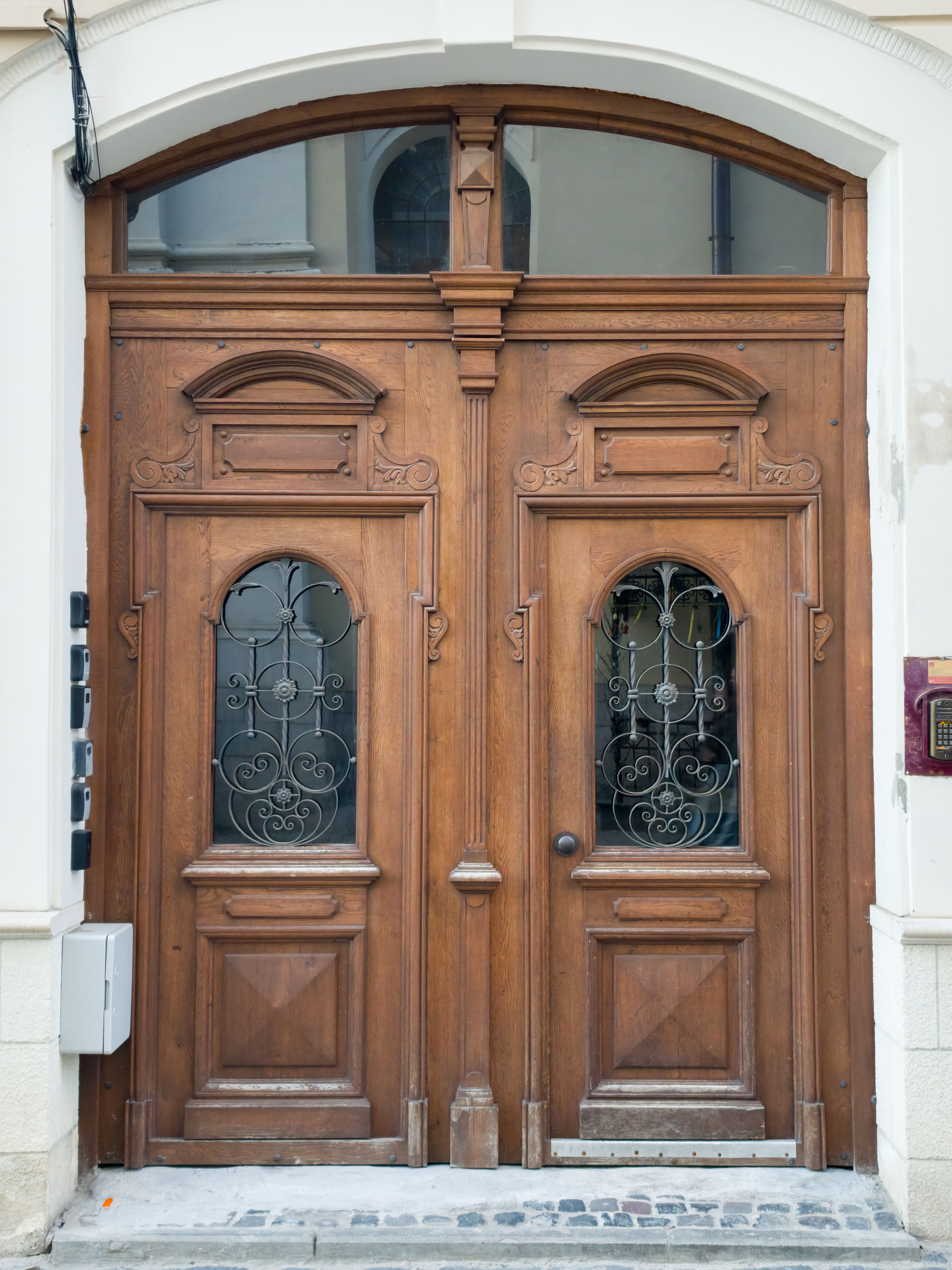 Beautifully crafted wooden doors with intricate ironwork, located in Lviv, Ukraine.