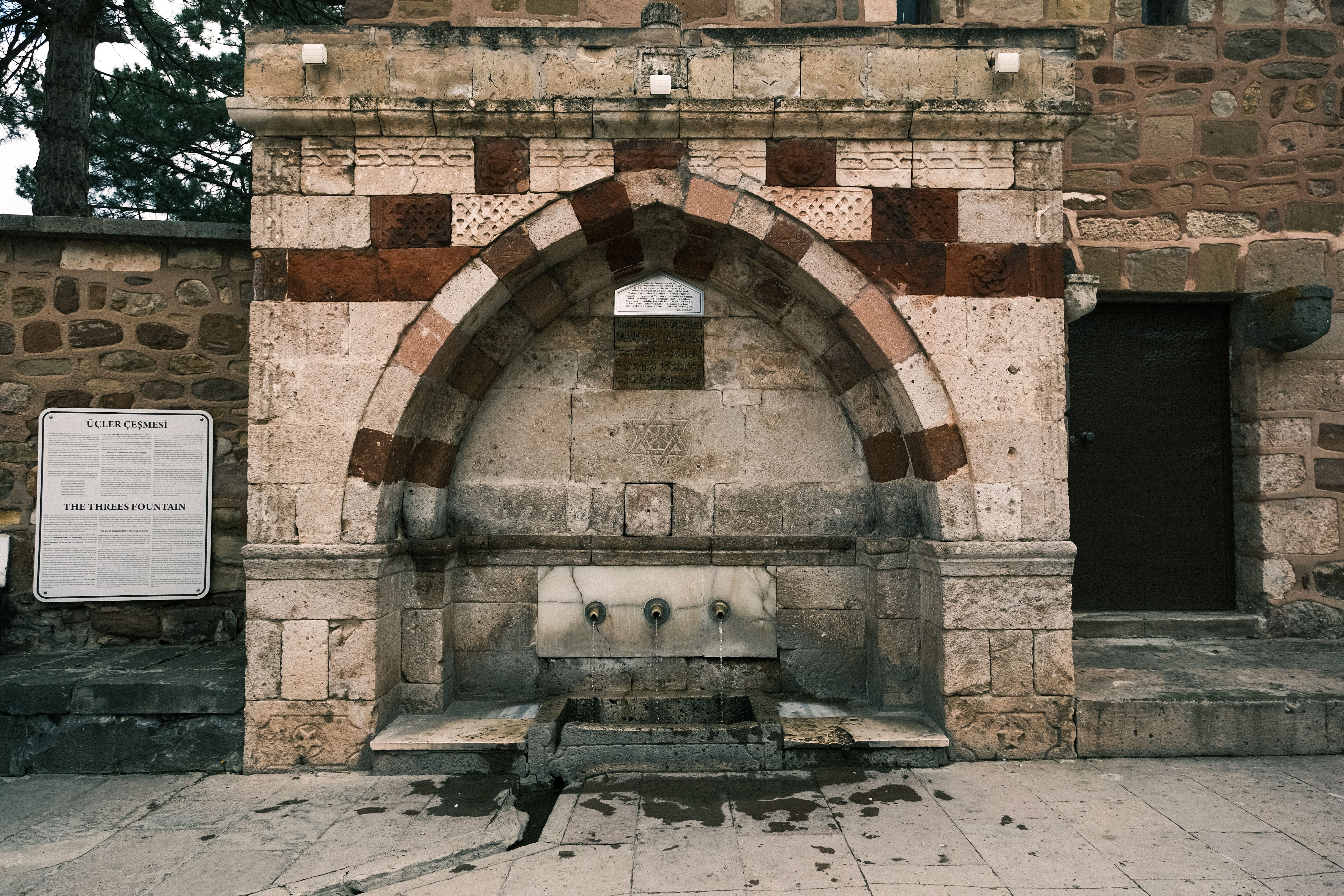Ancient Tiberius Fountain with detailed stonework in Aizanoi, perfect for historical architecture enthusiasts.