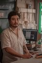 Man In White Button Up Shirt Standing Beside Computer