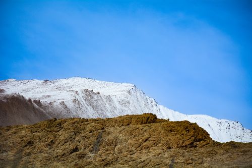 Free Majestic snow-capped mountains under a clear blue sky in LA, India. Stock Photo