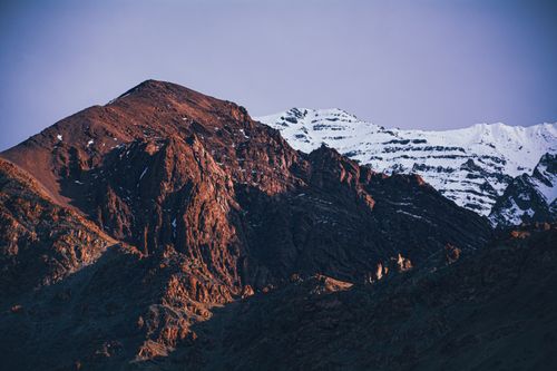 Free Stunning view of the Himalayas with rocky peaks and snow, captured at sunrise with vibrant colors. Stock Photo