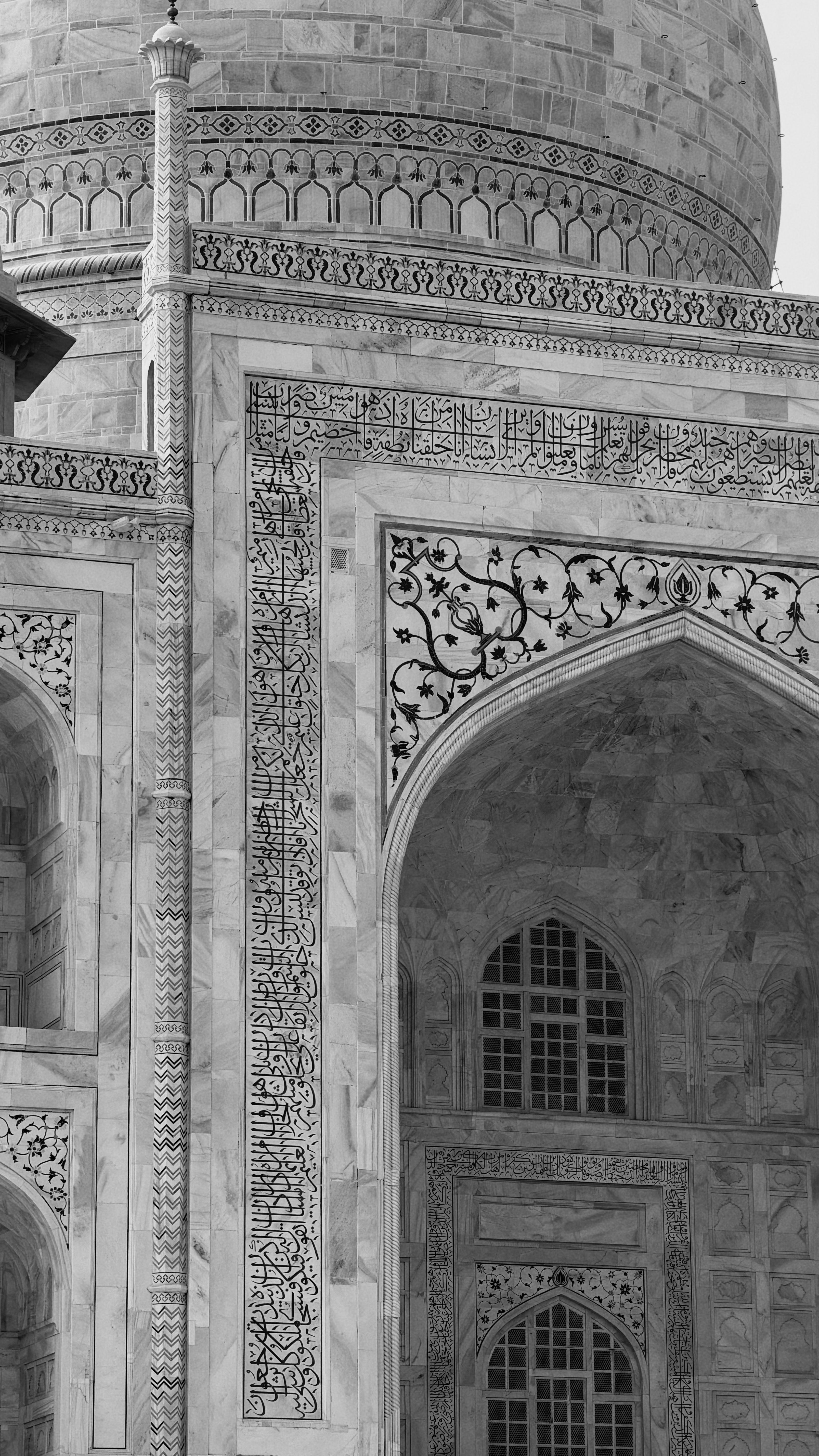 Intricate marble carvings on the Taj Mahal's exterior in Agra, India.