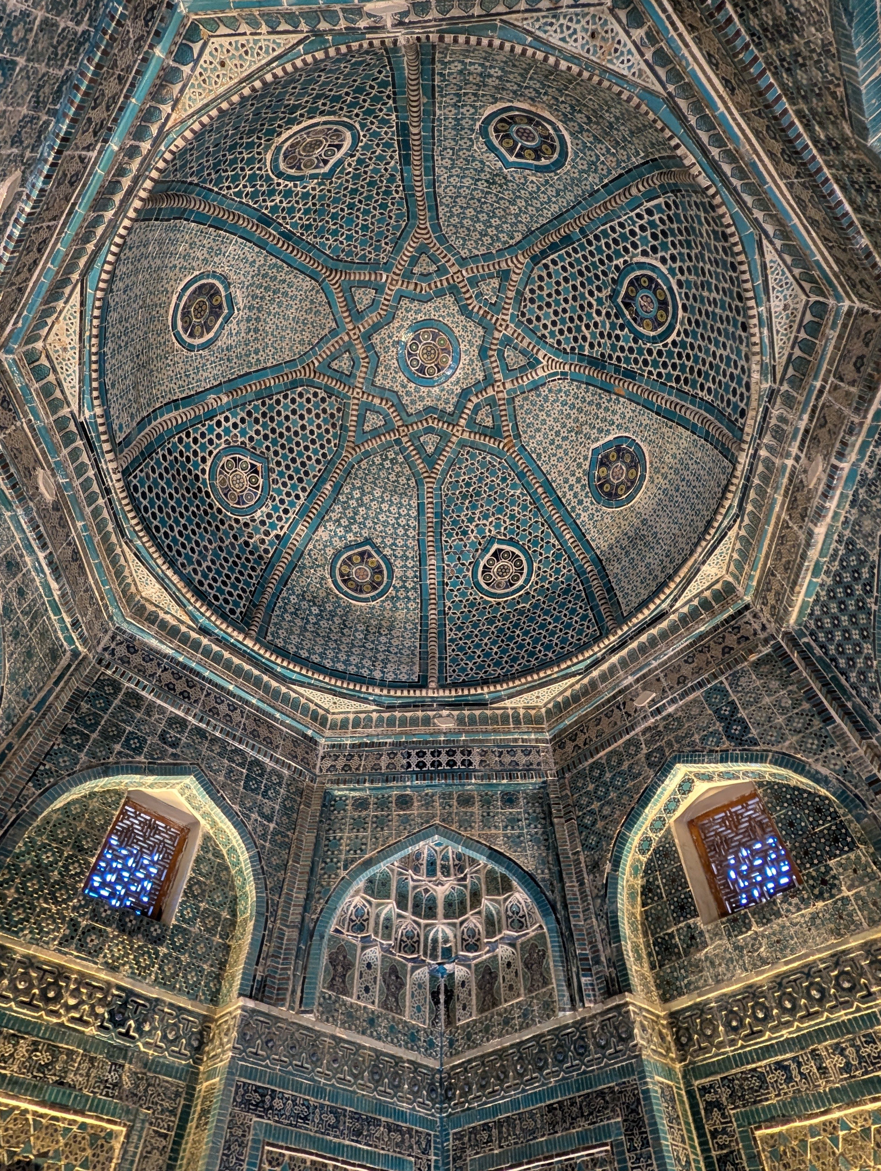Exquisite interior dome showcasing intricate Islamic architectural design with vibrant patterns.