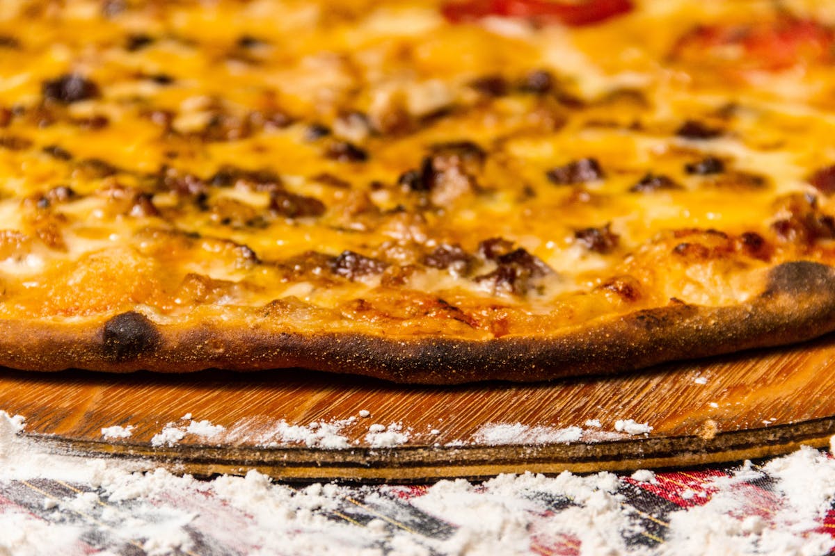 Sliced roasted chicken breast on a cutting board