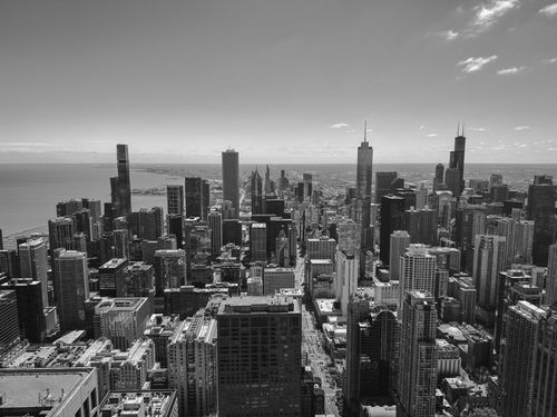Free Dramatic black and white aerial view of Chicago, highlighting its iconic skyline and architecture. Stock Photo