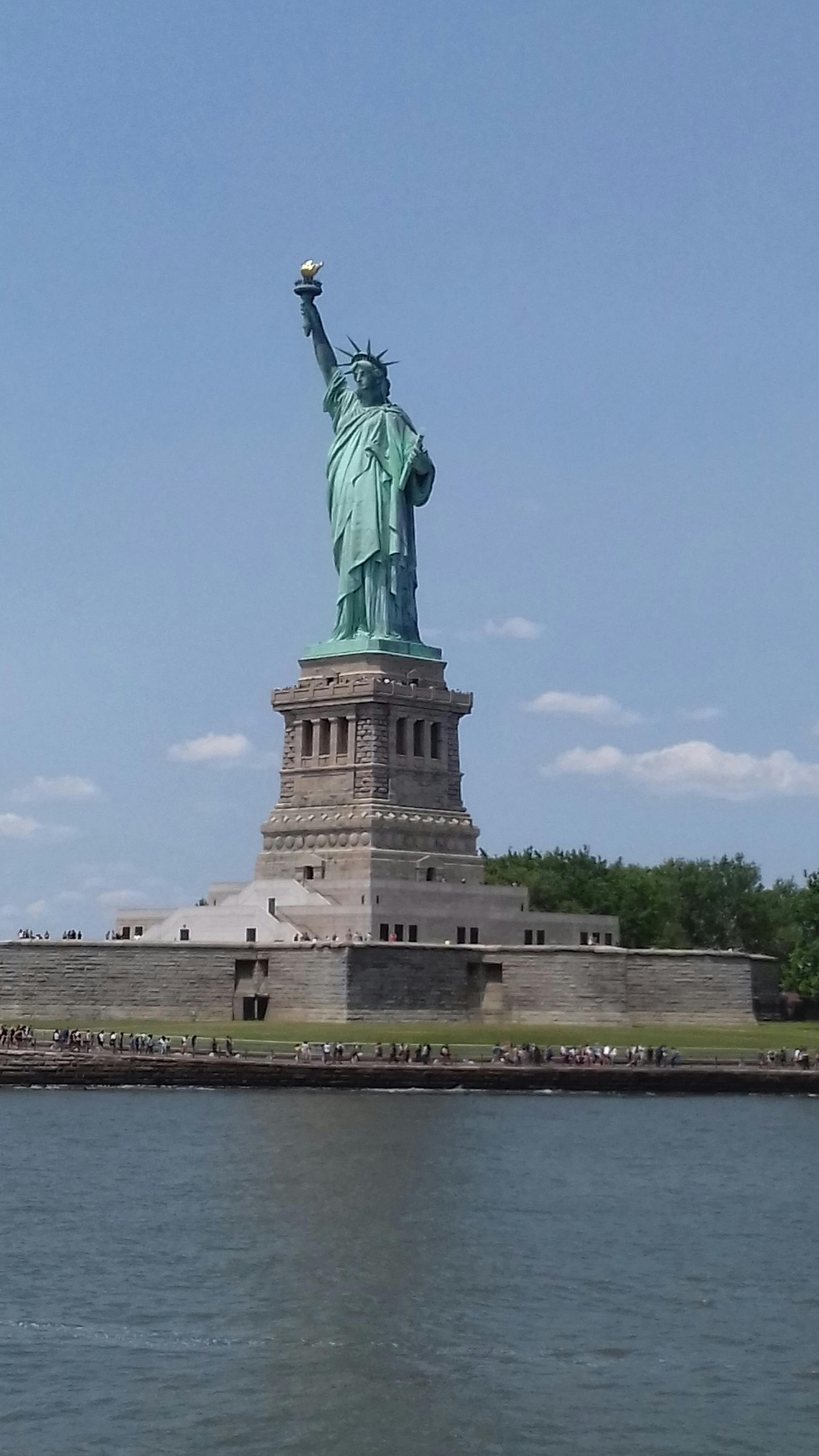 Top view of a bowl filled with healthy toppings such as fruit and seeds