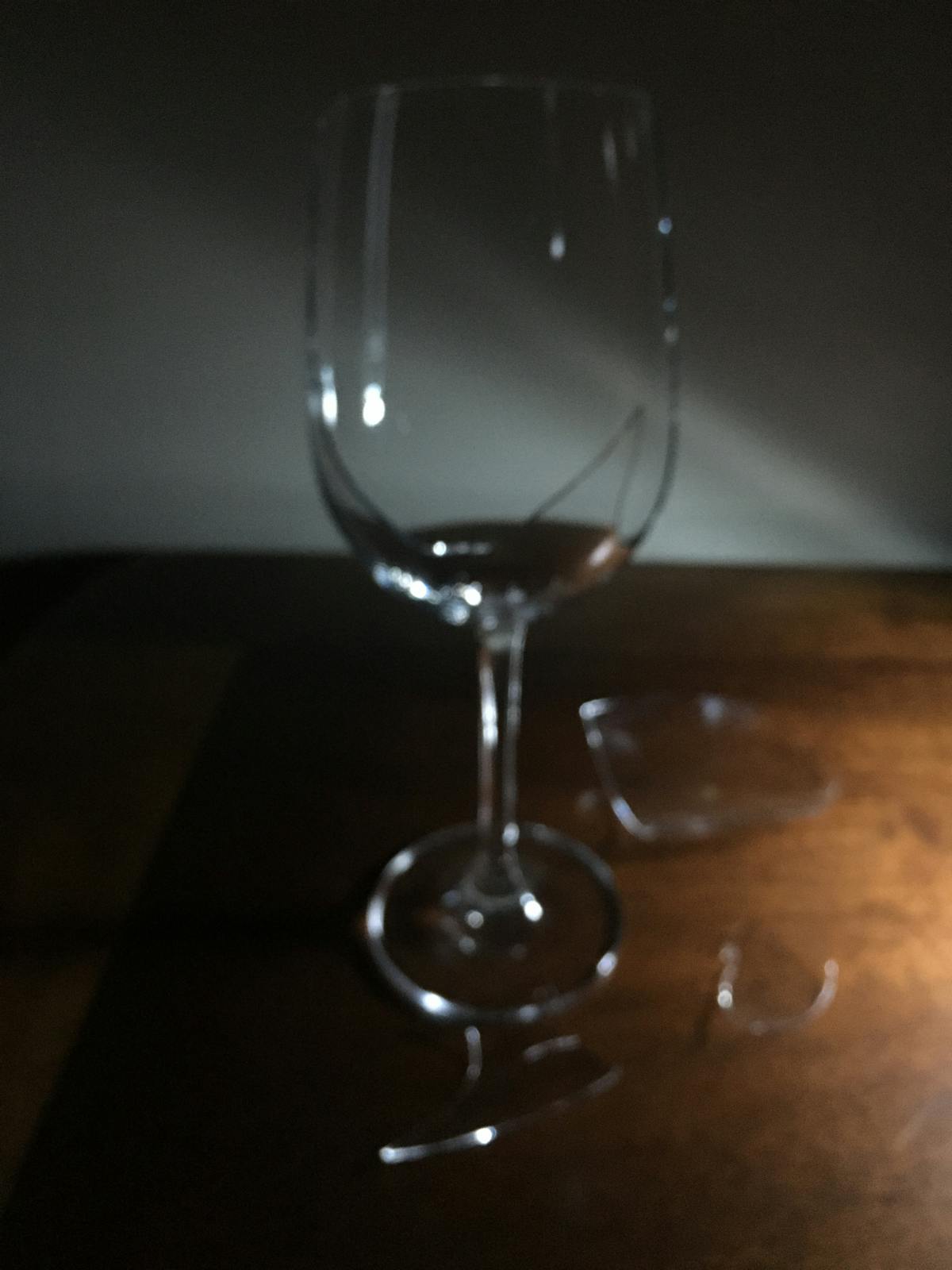 Hands assembling a colorful bowl with grains, vegetables, and toppings