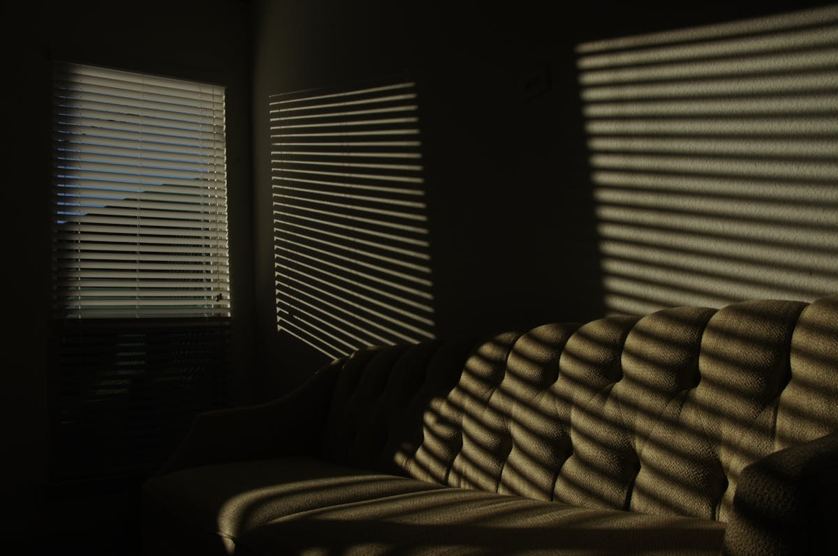 Tempeh pieces sizzling in a pan, turning golden brown