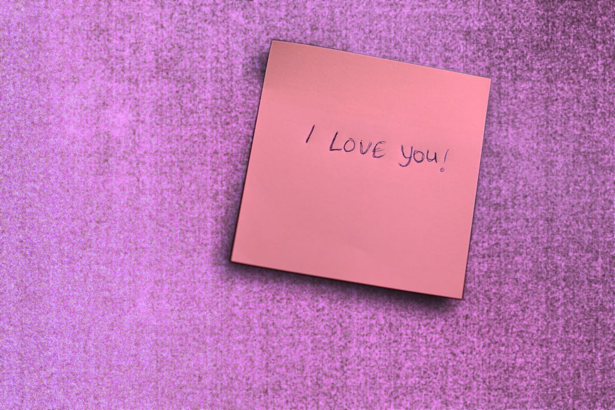 Cooked lentils in a pot with a wooden spoon