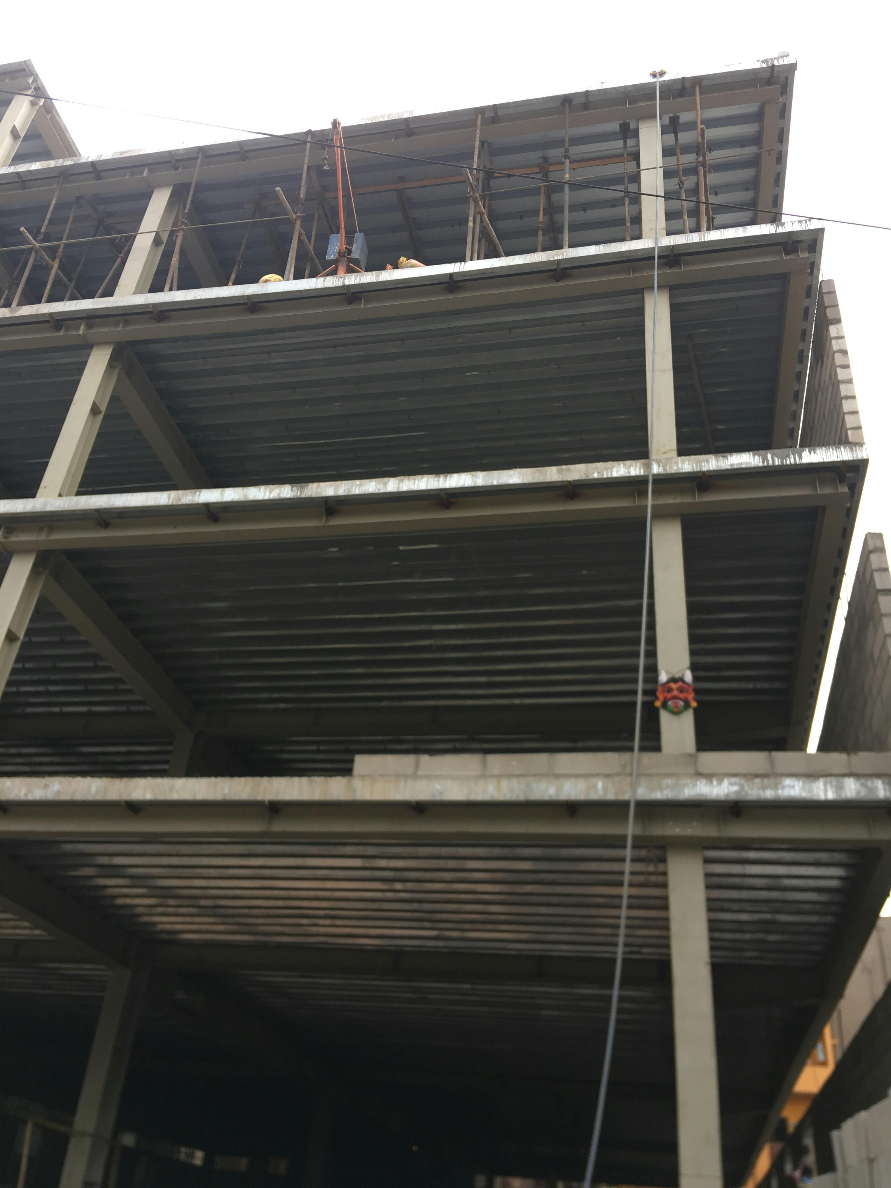 A breakfast spread with yogurt bowl, eggs and fresh fruit arranged neatly