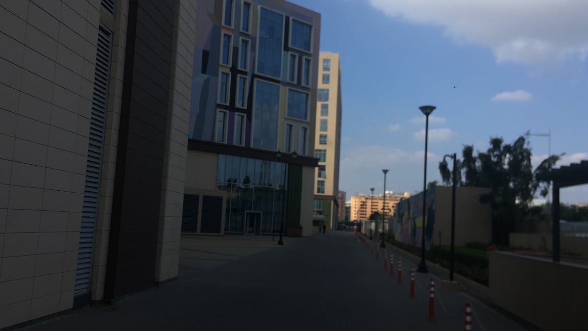 Marinated tempeh cubes cooking in a skillet