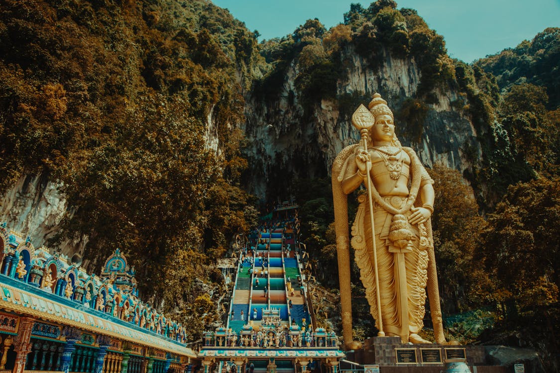 Gold Statue Near Green Trees