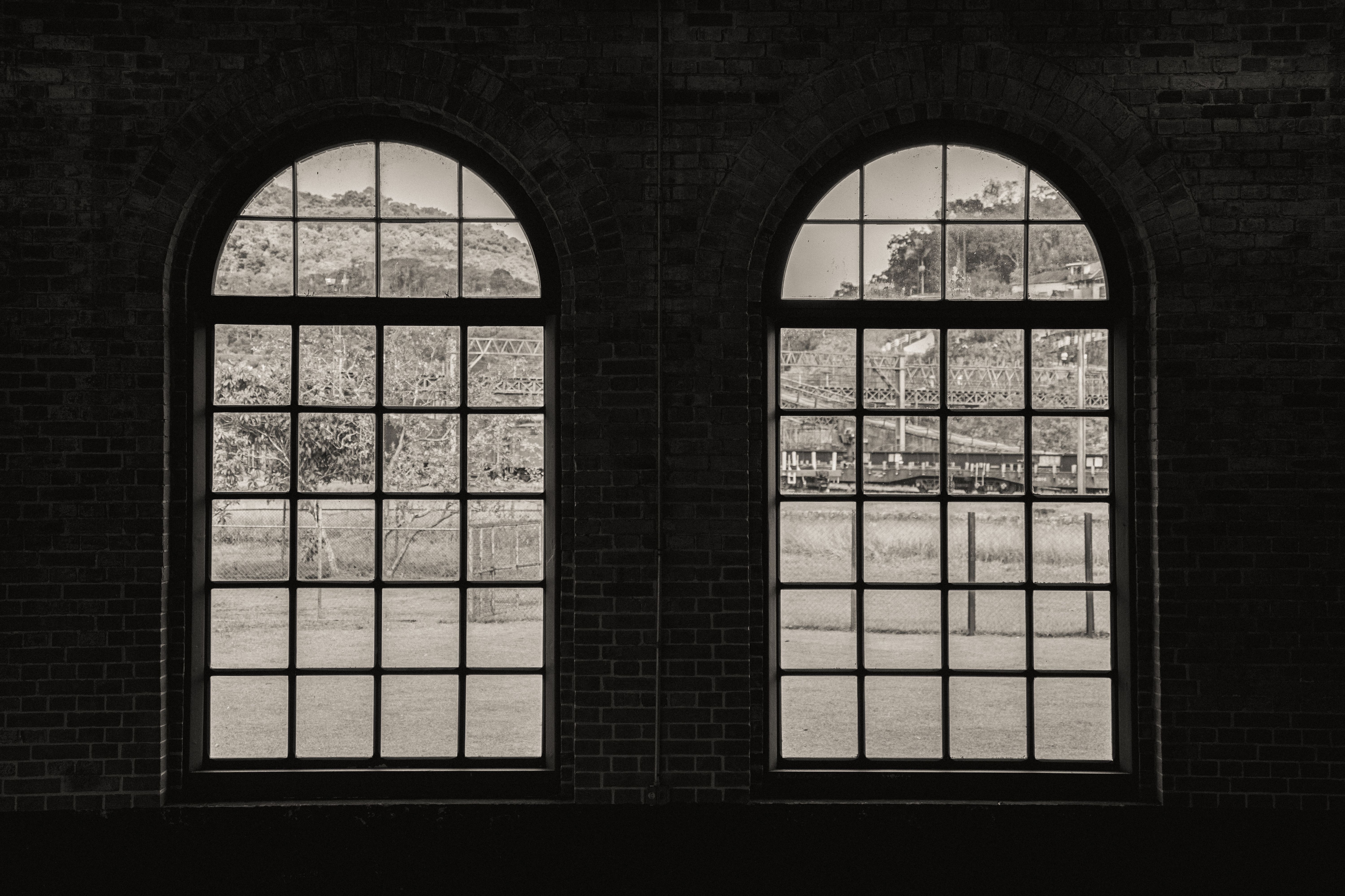 Black and White View Through Large Arched Windows · Free Stock Photo
