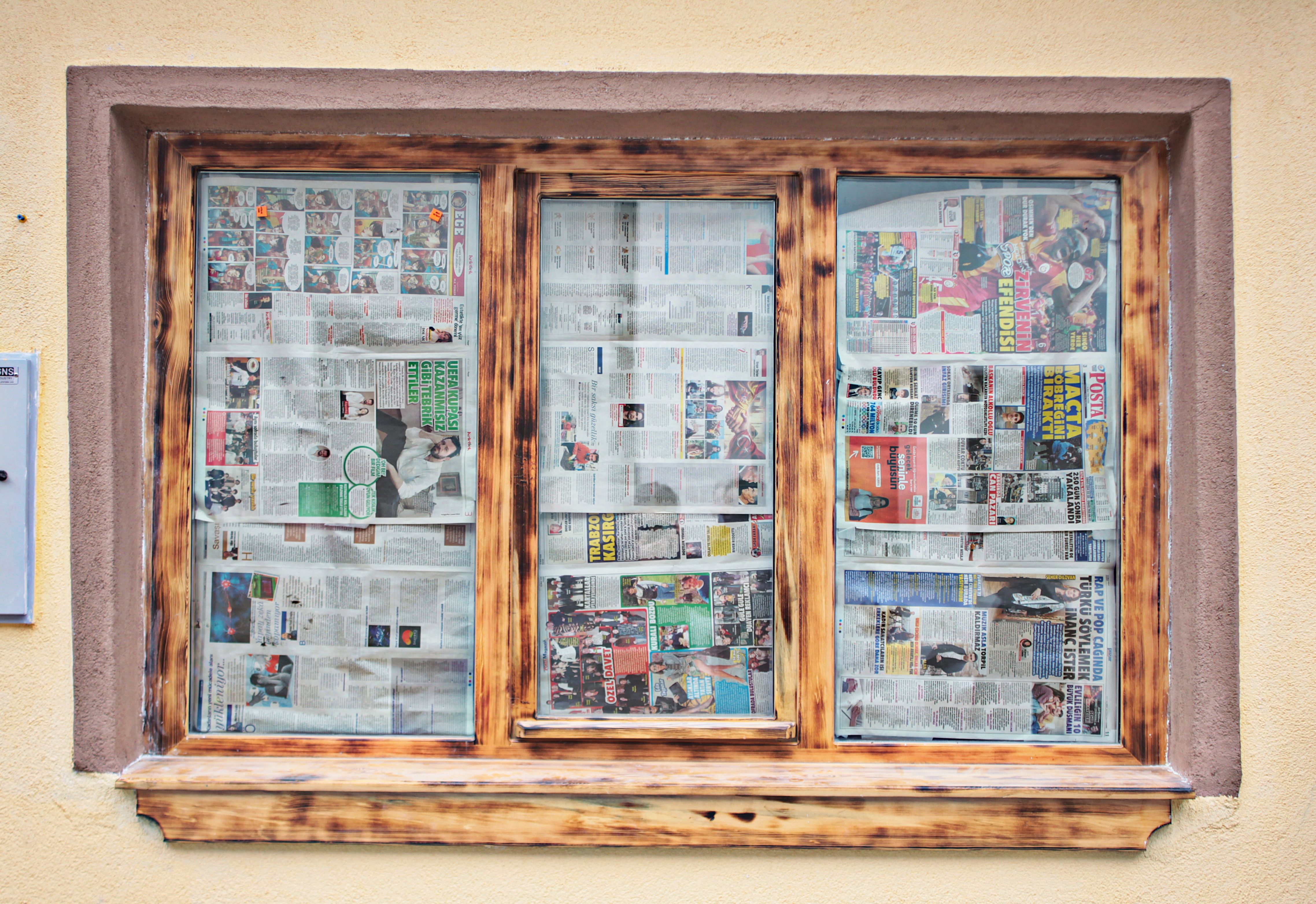 Window Covered with Newspaper Panels · Free Stock Photo