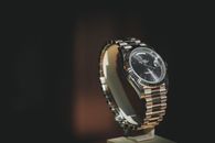 A close-up shot of a luxury watch with a metallic bracelet, showcasing elegance and precision.