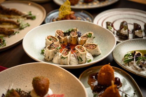 Free A beautifully arranged gourmet platter featuring a variety of exquisite dishes perfect for a culinary showcase. Stock Photo