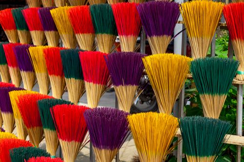 Free Vibrant bundles of incense sticks on display, Hué, Vietnam. Perfect for cultural themes. Stock Photo