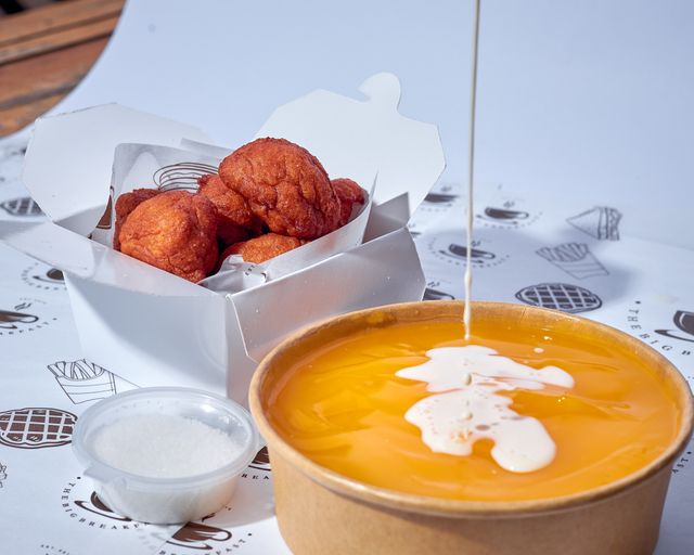 Tempting image of Nigerian puff puff paired with creamy pap and condensed milk.