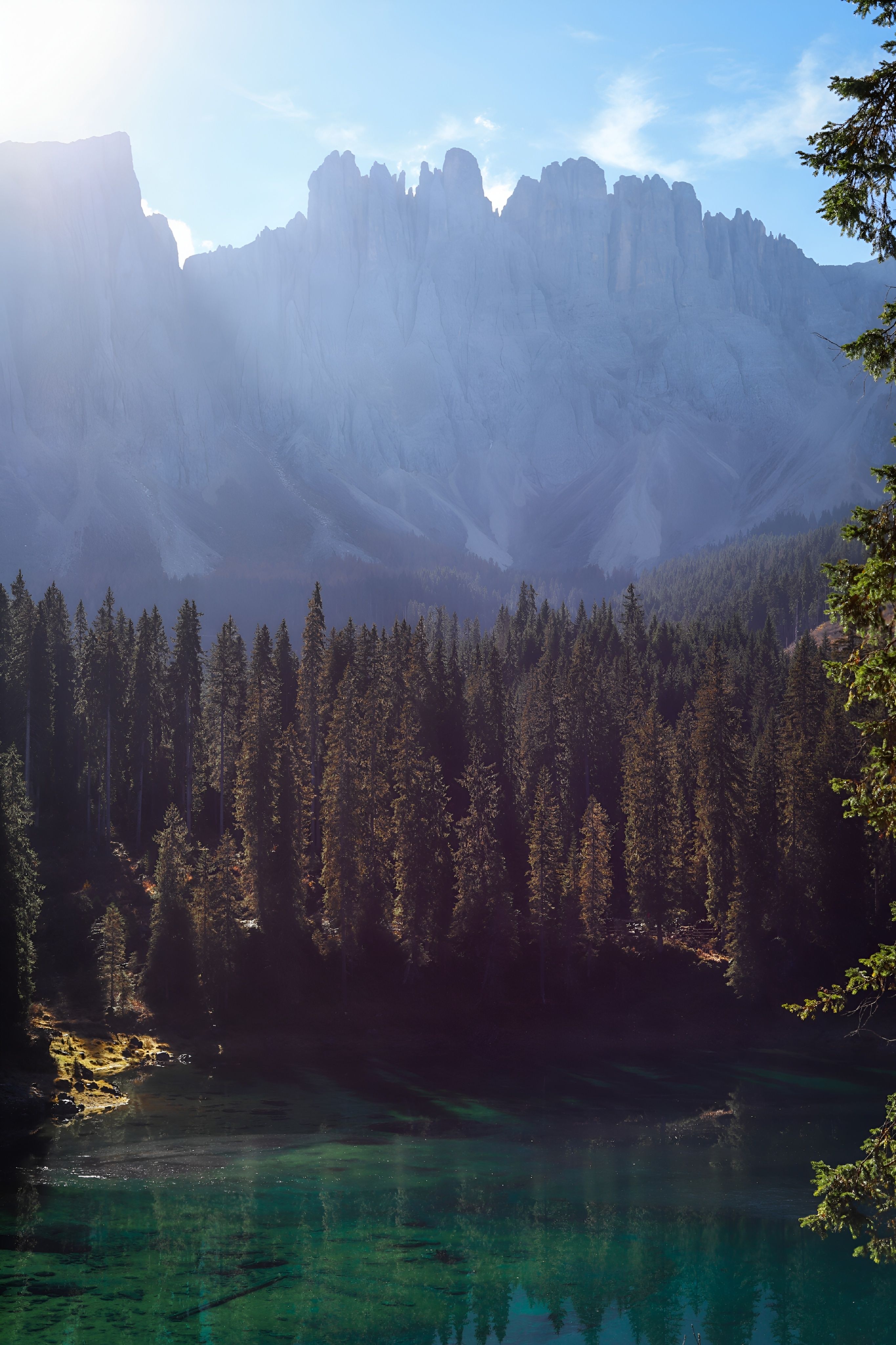 A mountain ridge and emerald lake create a calm backdrop for planning.
