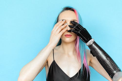 Woman in Black Spaghetti Strap Top Covering Her Eyes