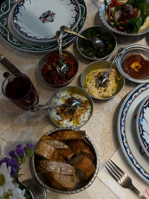 Free Overhead view of a variety of Turkish meze dishes with bread on a decorative table setting. Stock Photo