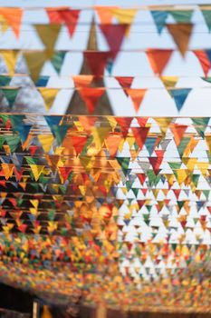 Vibrant triangular flags hanging outdoors, capturing the festive spirit in Kaliningrad, Russia.