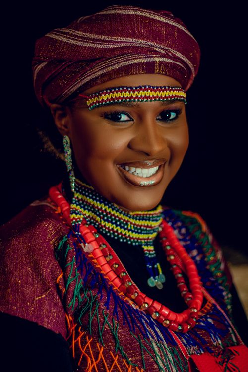 Free Vibrant portrait of a woman in traditional African attire with colorful jewelry. Stock Photo