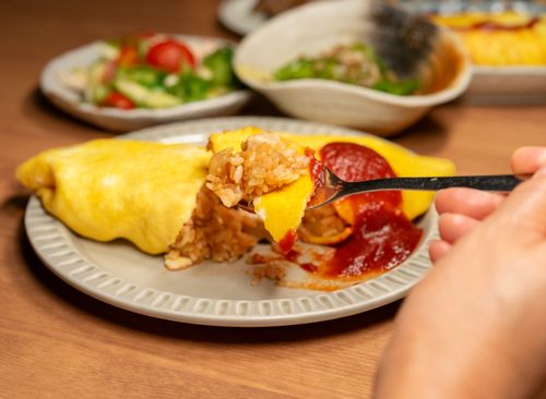 Free A close-up of Japanese omurice, an omelette rice dish, served with ketchup on a plate. Stock Photo