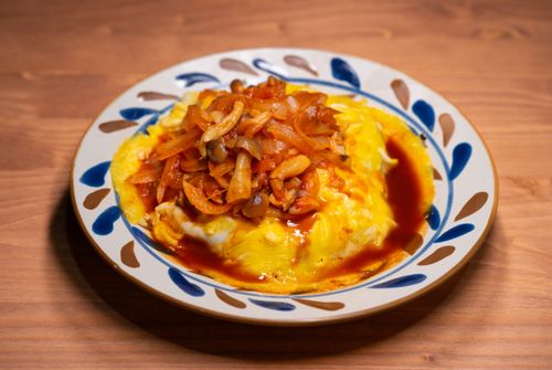 Free Savor the taste of omurice with mushroom sauce in this appetizing Japanese dish. Stock Photo