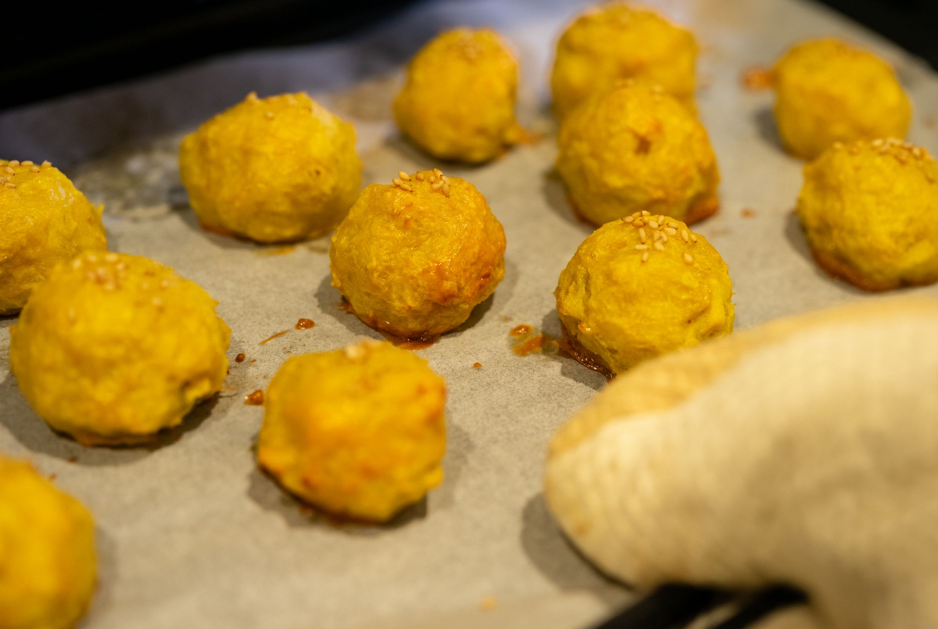 Mini cheese balls coated with various toppings