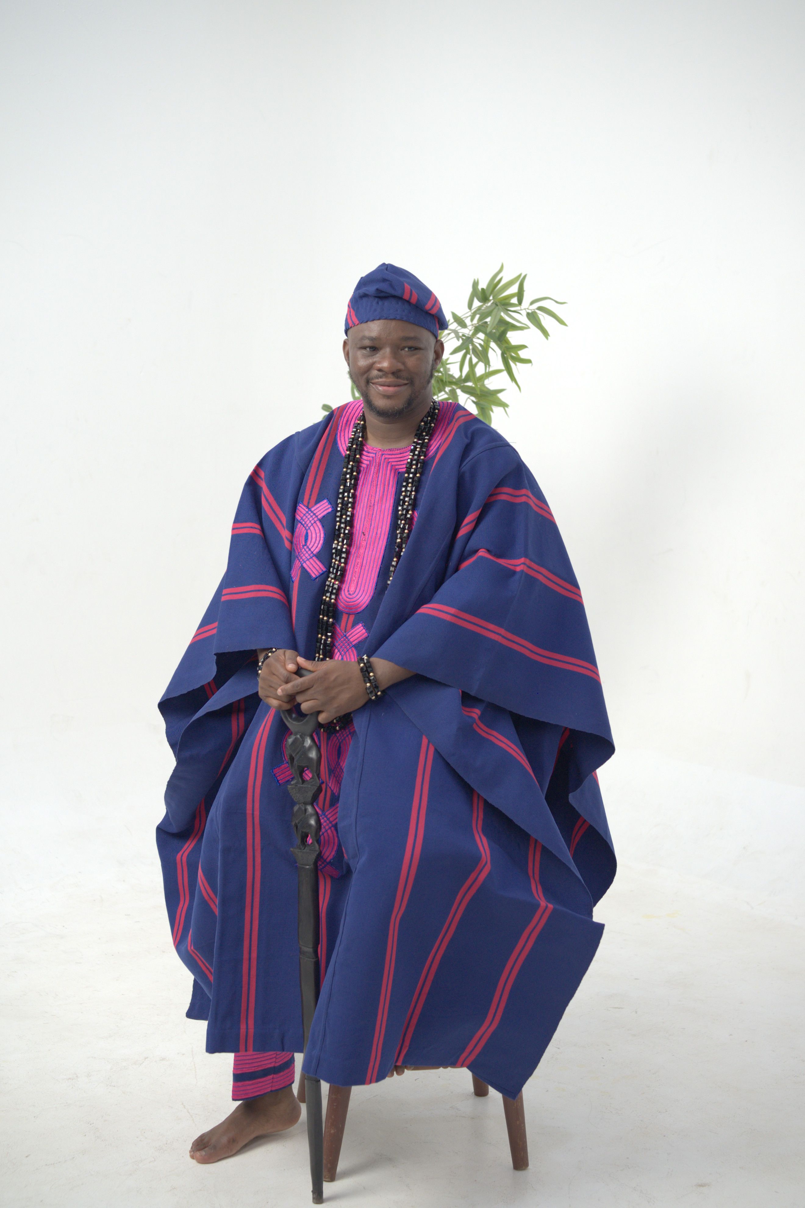 Elegant portrait of a man in Nigerian traditional wear, showcasing cultural heritage.