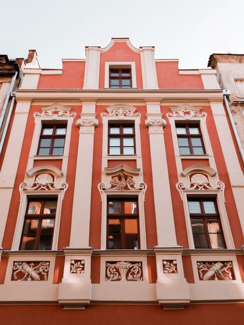Free Elegant pink and white historic building façade in Lower Silesian Voivodeship, Poland. Stock Photo