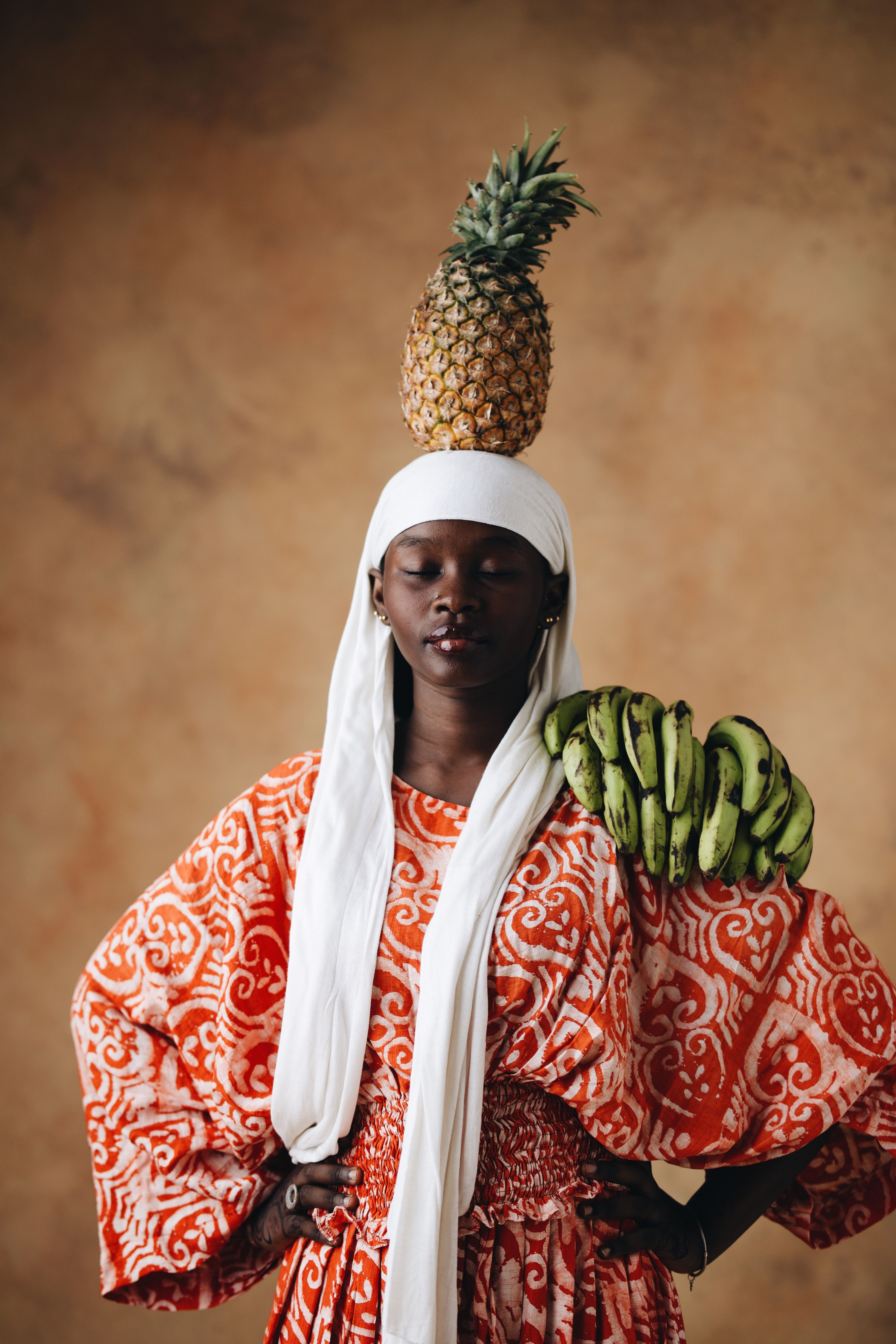African Woman Balancing Pineapple and Bananas · Free Stock Photo