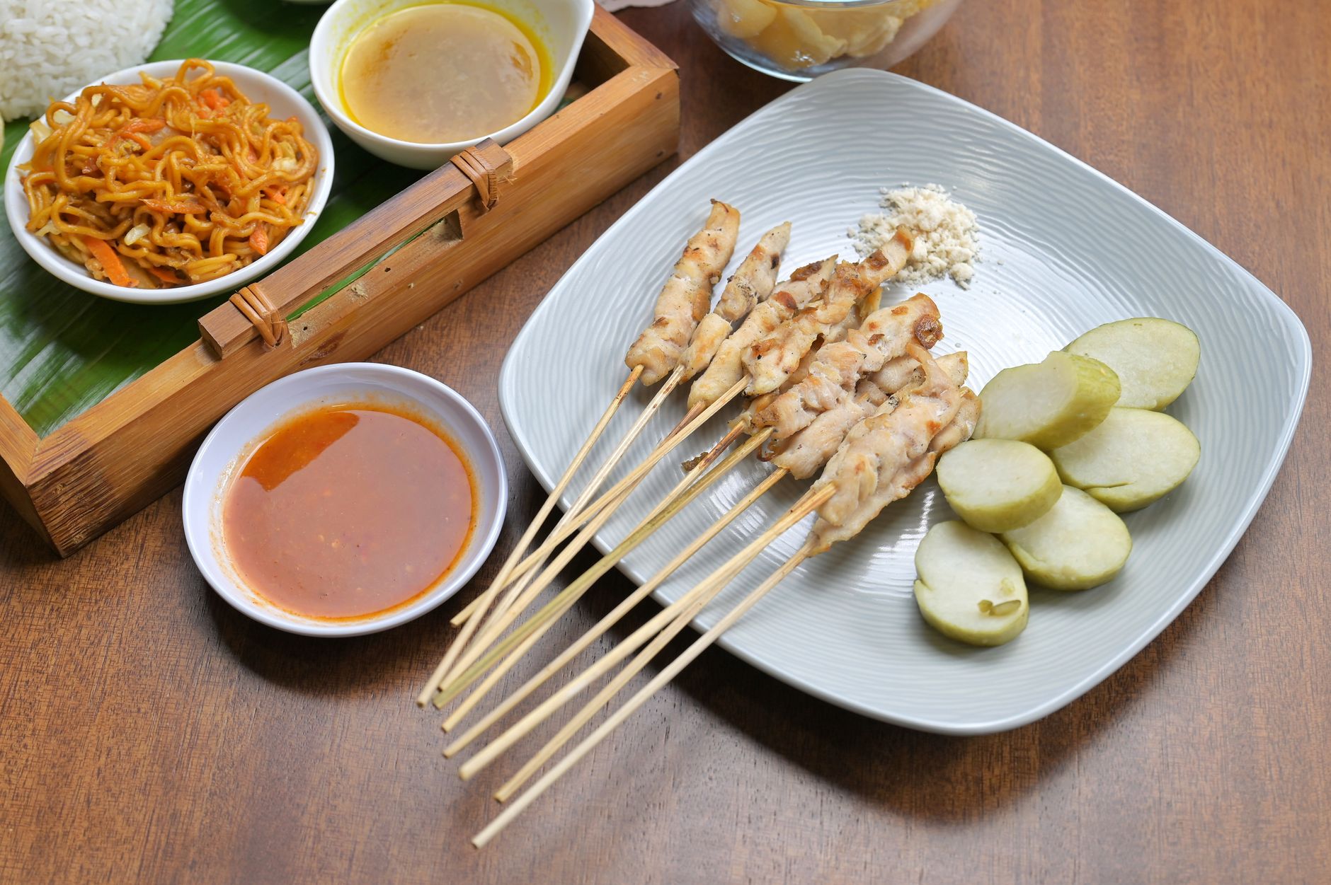 Freshly grilled spicy chicken skewers on a serving plate