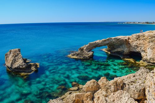 Free Idyllic coastal view of Cyprus arch and turquoise sea, perfect for summer travel inspiration. Stock Photo