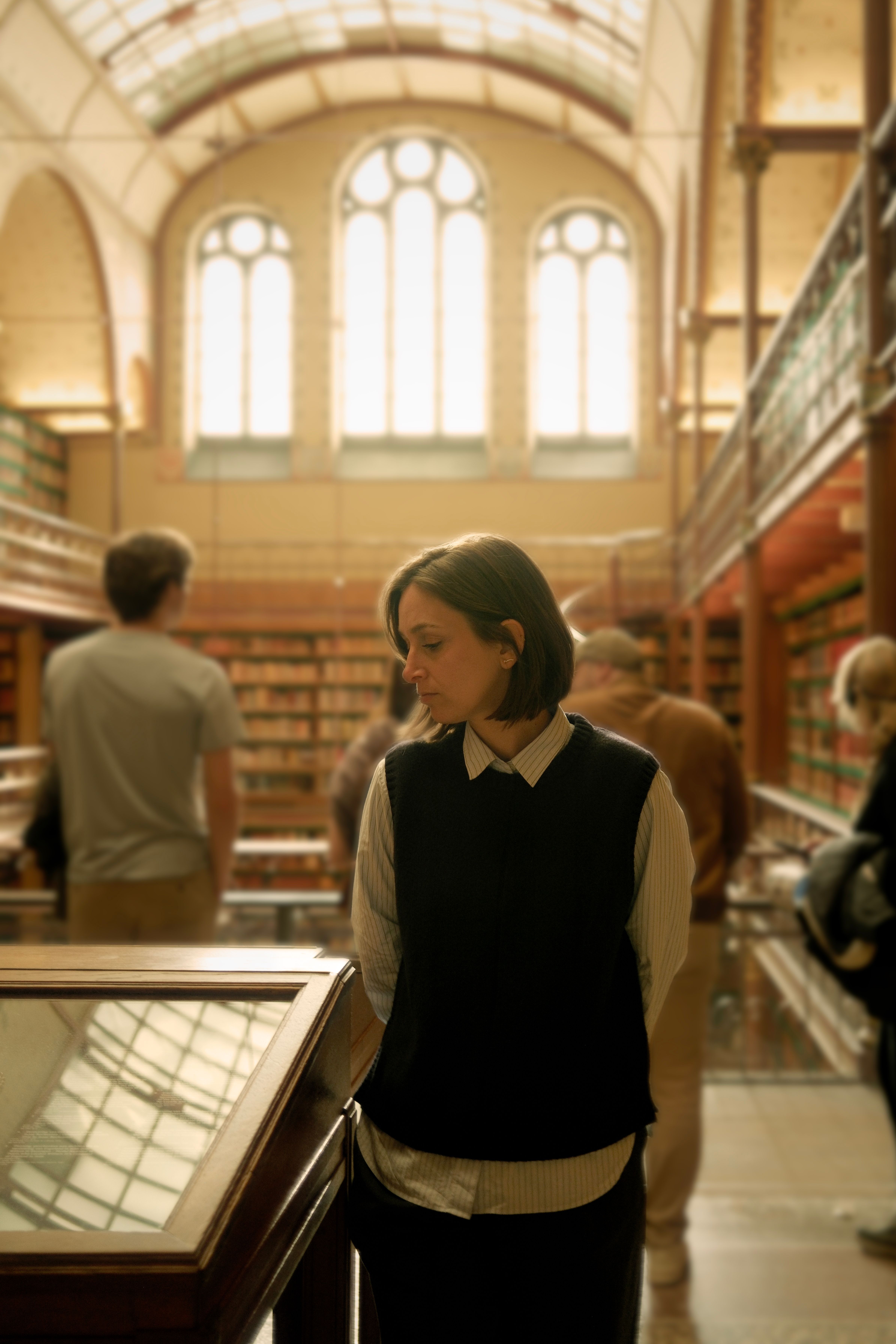 Contemplative Moment in Historic Library · Free Stock Photo