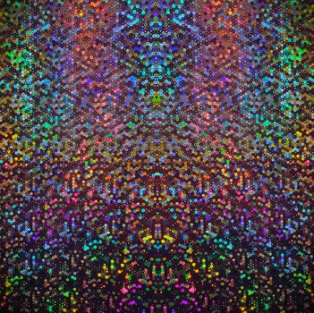 Colorful sequin pattern with rainbow hues creates a mesmerizing abstract backdrop.