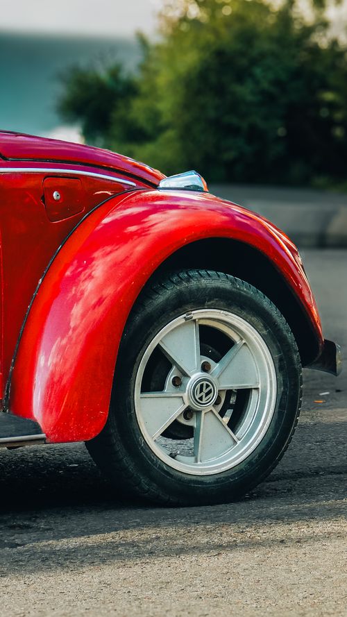 Free Photo of a red vintage car wheel in Ankara, Türkiye, highlighting classic automotive design. Stock Photo