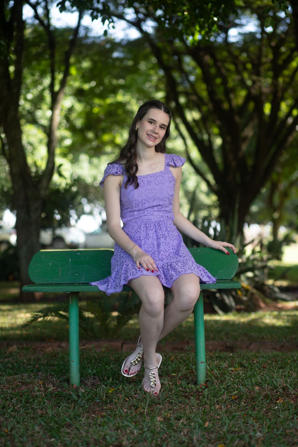 Young Woman in Purple Dress on Park Bench · Free Stock Photo