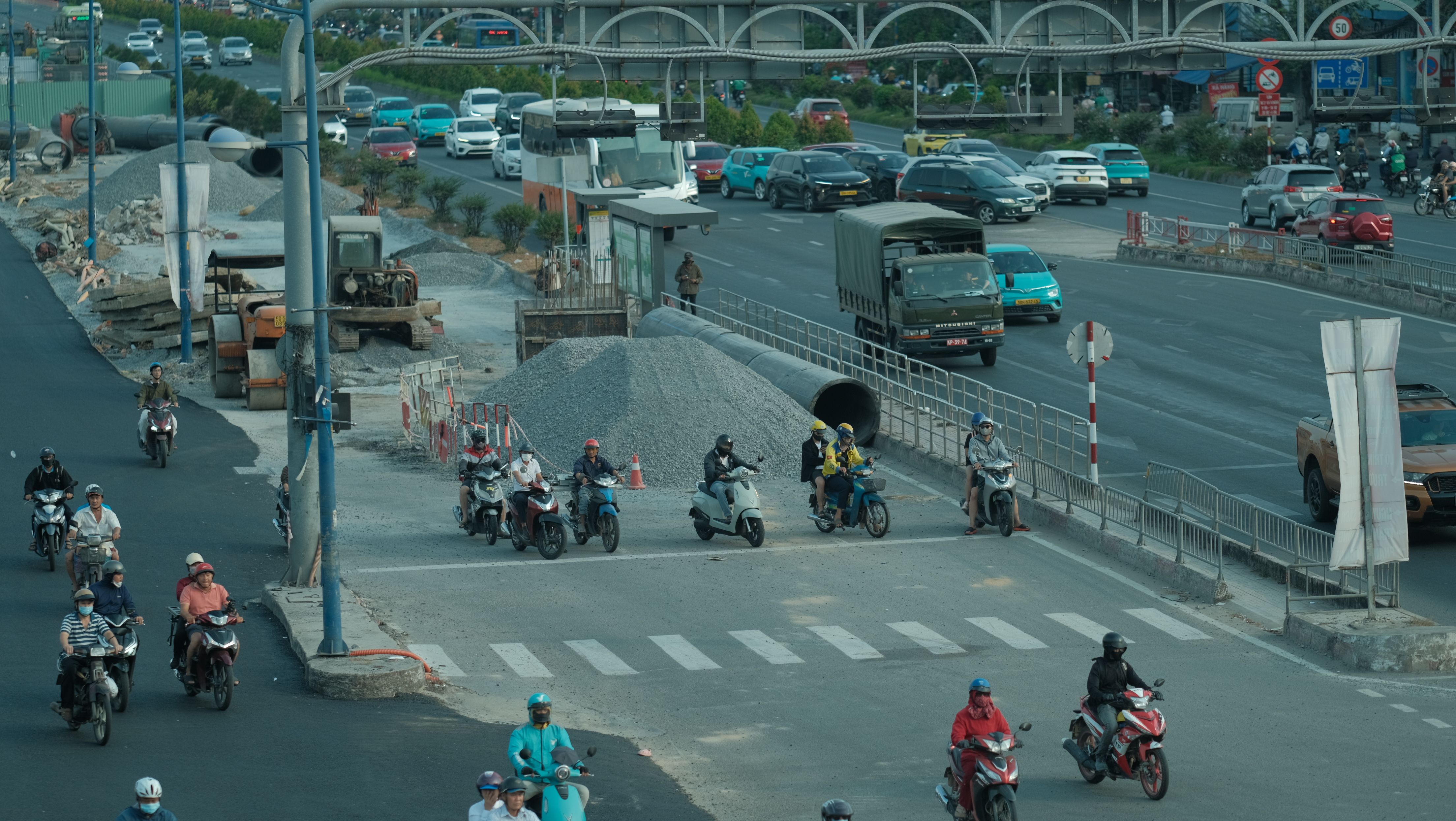 Traffic circling the Palarivattom junction flyover on Kochi's bypass at dusk