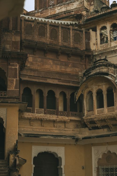 Free A detailed view of the intricate sandstone architecture at a historic palace in Jodhpur, Rajasthan. Stock Photo