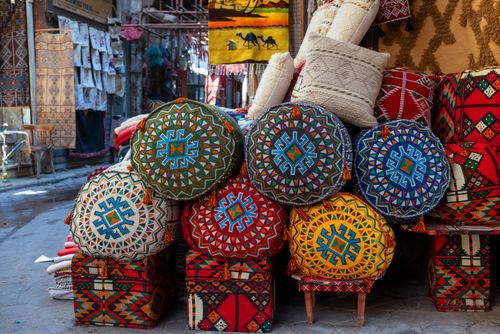 Free Vibrant handmade textiles and crafts at a Cairo market street. Stock Photo