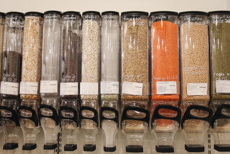 Bulk bins filled with affordable grains, beans, and legumes - plant based diet affordable Bulk bins filled with affordable grains, beans, and legumes - plant based diet affordable