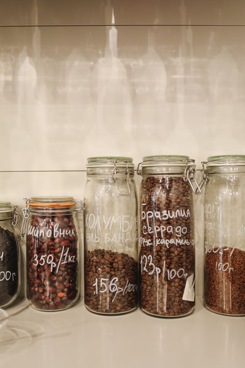 Free Neatly arranged glass jars filled with spices and coffee beans, promoting zero waste storage. Stock Photo