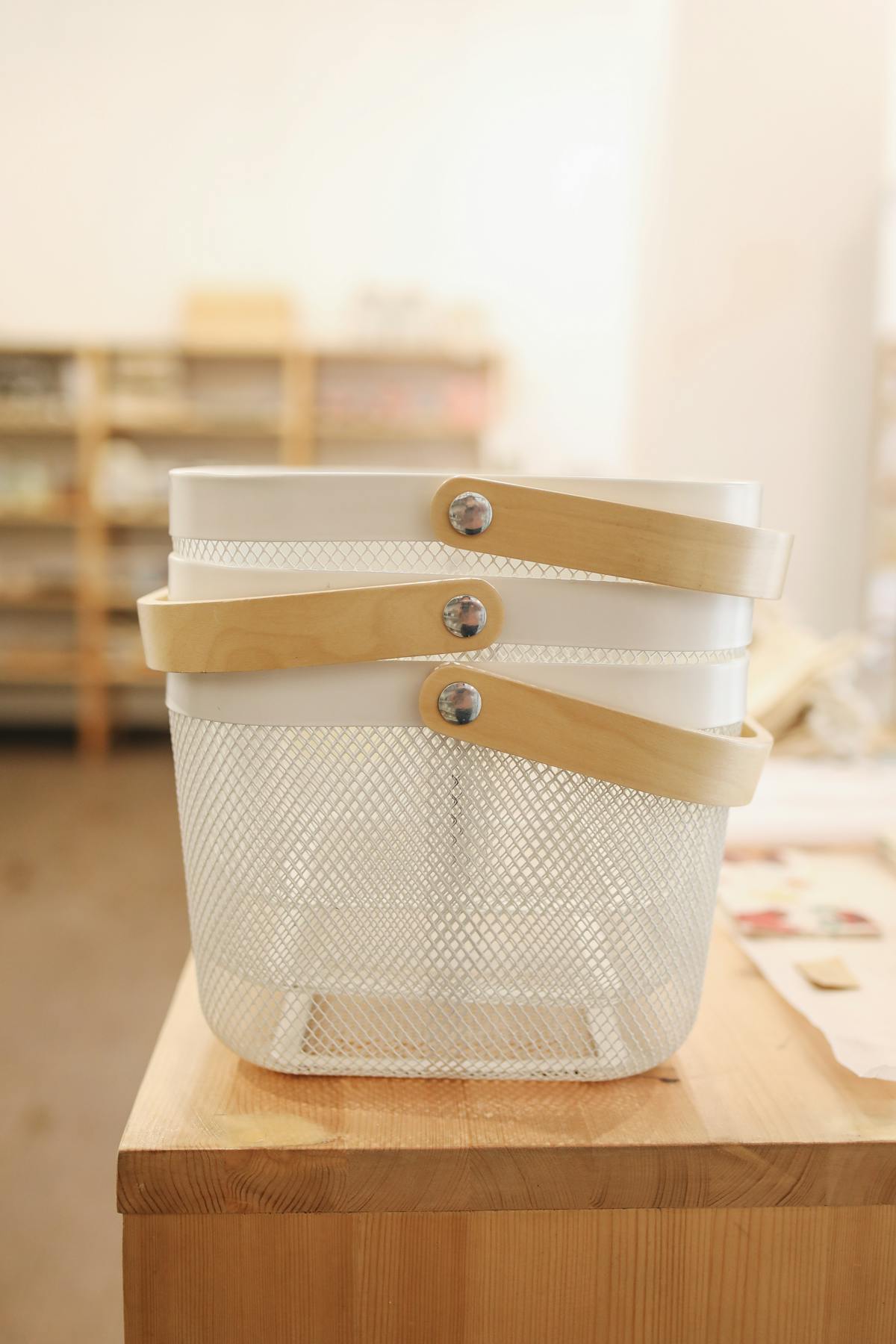 Ceremonial grade matcha powder and whisk on a wooden board