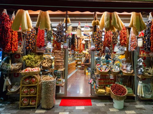 Free Vibrant display of dried peppers, spices, and herbs at a local spice shop. Stock Photo